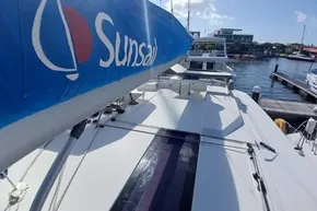 2022 Leopard 45 catamaran docked, featuring Sunsail branding on the sail.