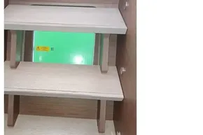 Wooden interior stairs of a 2020 Lagoon 46 catamaran.