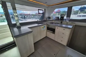 Modern kitchen interior on a 2020 Leopard 45 yacht, featuring sleek countertops and appliances.
