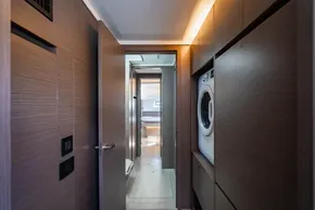 Modern interior of 2025 Leopard 46 yacht with wood paneling and washer.