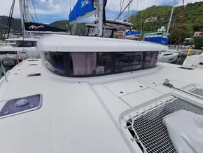 2020 Lagoon 42 catamaran docked, showcasing sleek design and spacious deck.