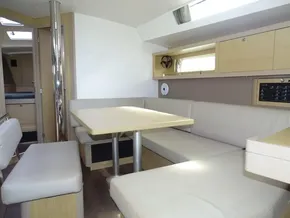 2017 Beneteau Oceanis 45 interior with modern dining area and light wood finishes.